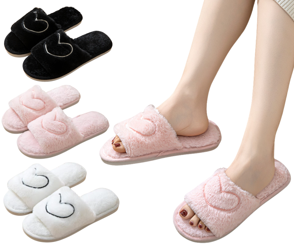 Pink slippers with heart designs worn by a person, with additional pairs displayed.