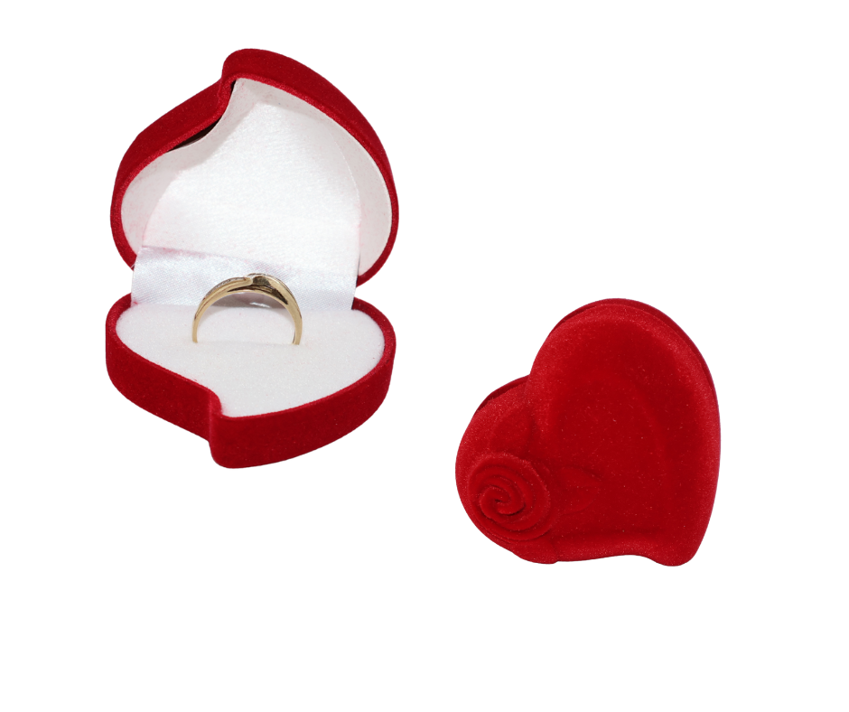 Red heart-shaped ring box with a gold ring inside on a white background