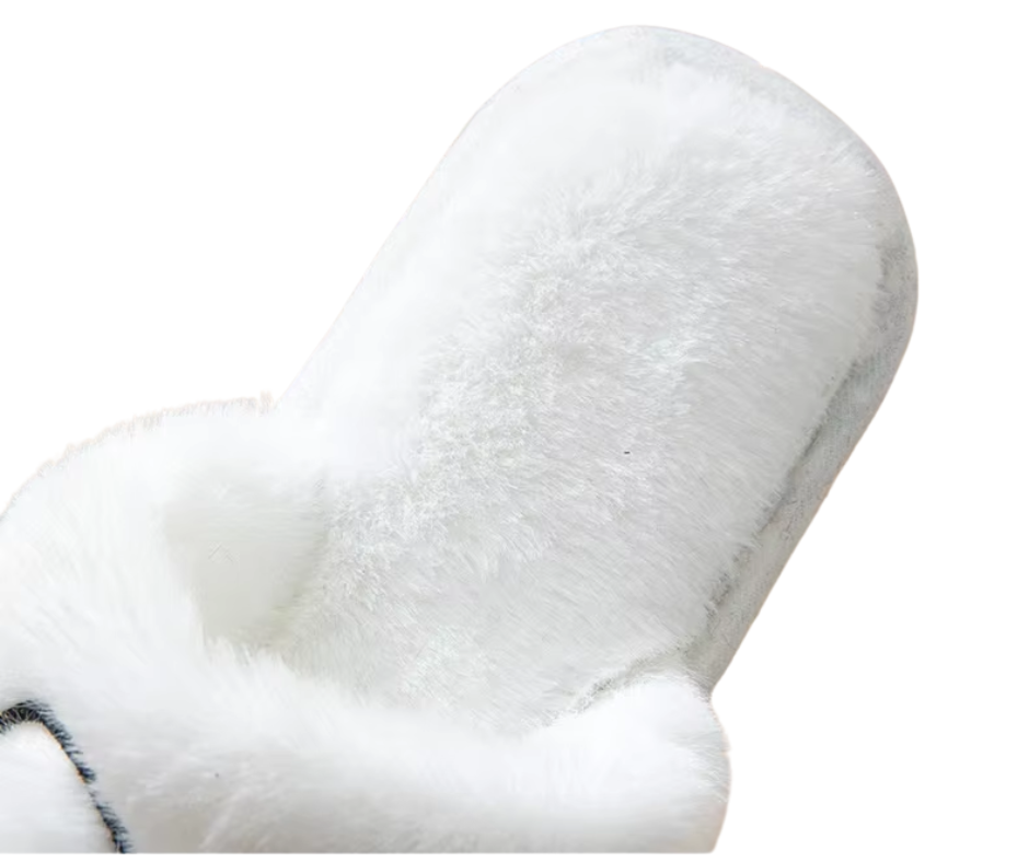 Close-up of a white slipper heel on a white background