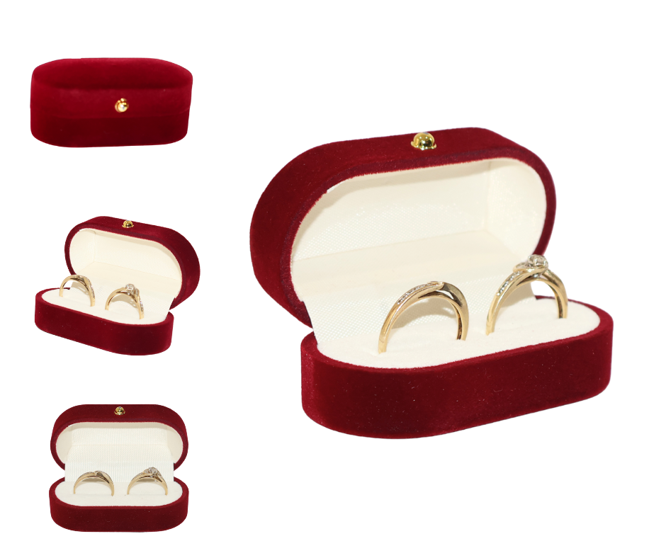 Red velvet double ring box with gold rings on a white background