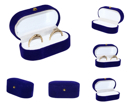 Showcase of a Blue velvet double ring box with gold rings inside on a white background