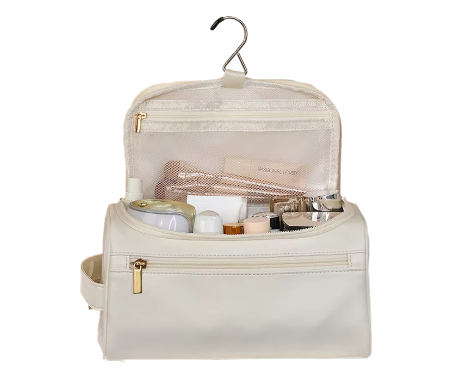 White toiletry bag with products on a white background