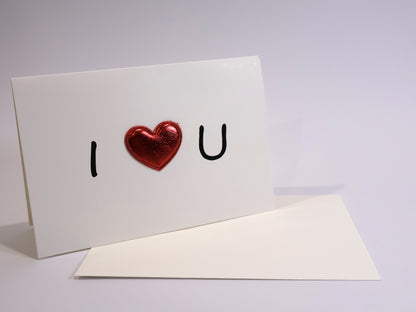 Greeting card with 'I ❤️ U' text on a white background